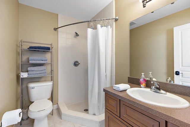 bathroom featuring vanity, tile patterned flooring, curtained shower, and toilet