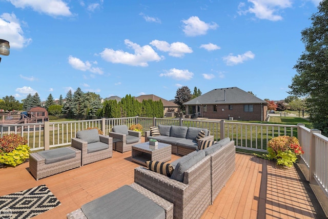 wooden terrace with an outdoor hangout area