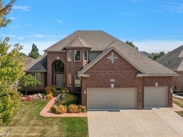 view of property featuring a front lawn