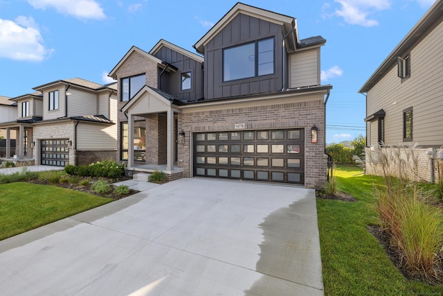 view of front of house with a front yard and a garage