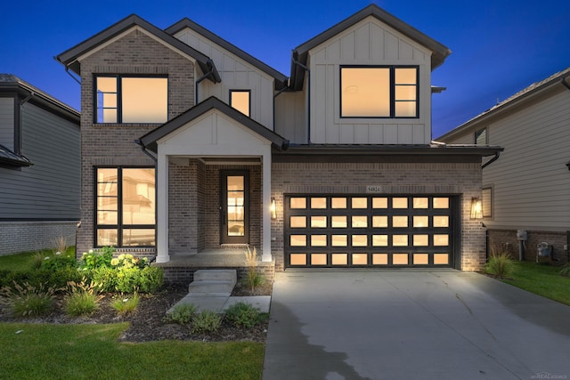 modern farmhouse style home featuring a garage