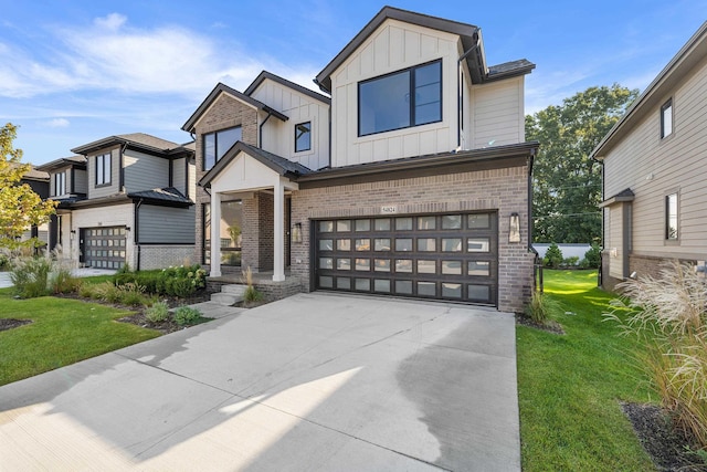 view of front of house featuring a front yard and a garage