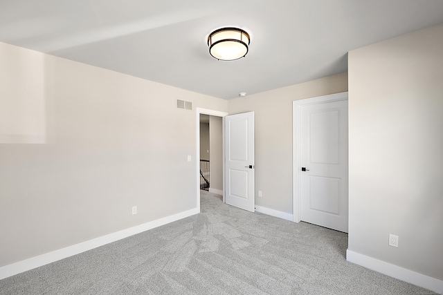 unfurnished bedroom with light carpet