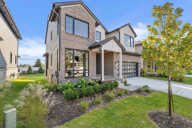 view of front of property featuring a garage and a front yard