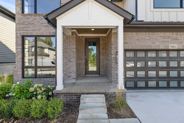 doorway to property with a garage