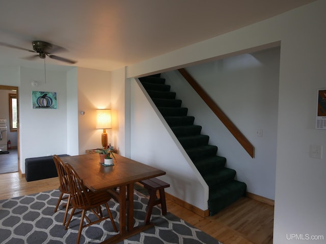 dining room featuring light hardwood / wood-style flooring and ceiling fan