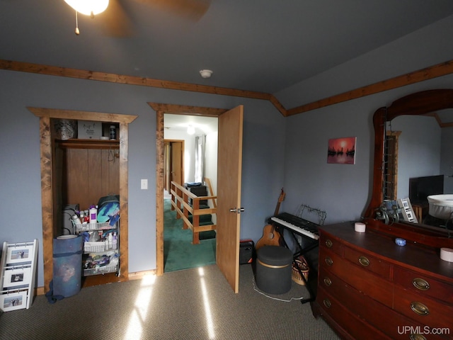 interior space with lofted ceiling, carpet, and ceiling fan