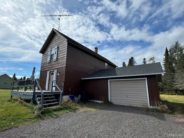 view of side of home featuring a garage