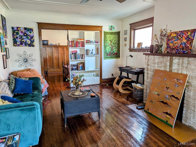 living room with crown molding, dark wood-type flooring, and ceiling fan