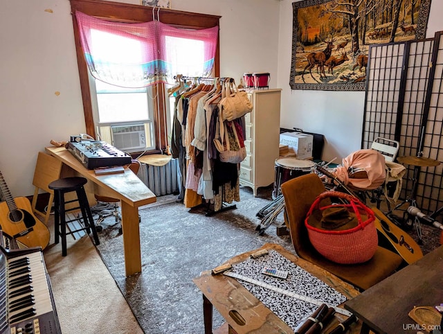 interior space featuring cooling unit, carpet flooring, and radiator heating unit