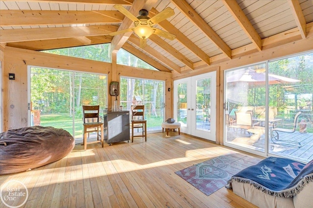 sunroom featuring ceiling fan, lofted ceiling with beams, french doors, and wooden ceiling