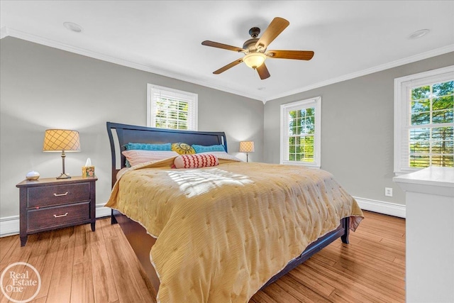 bedroom with ceiling fan, a baseboard radiator, light wood-type flooring, and crown molding