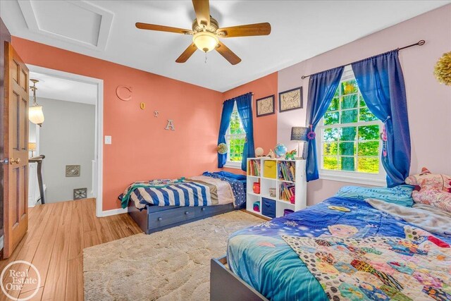 bedroom featuring wood-type flooring and ceiling fan