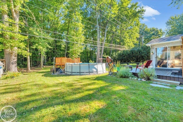 view of yard featuring a pool side deck