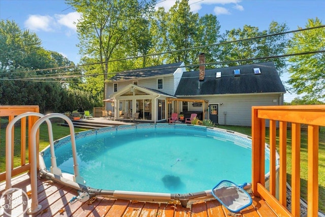 view of swimming pool with a deck