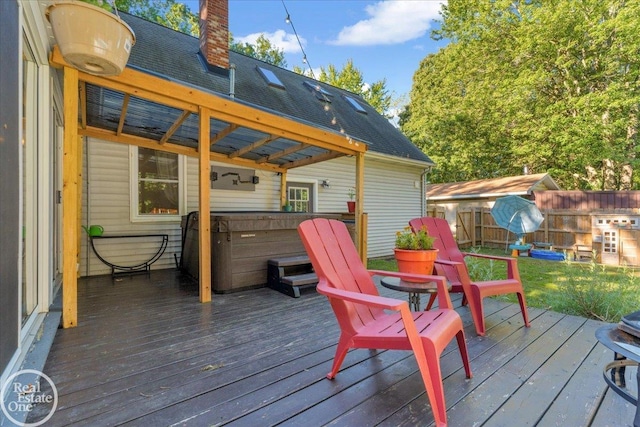 wooden terrace with a hot tub