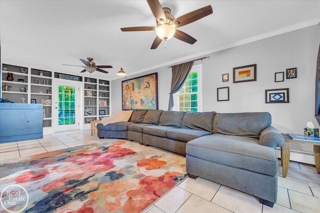 tiled living room featuring crown molding, built in shelves, and ceiling fan