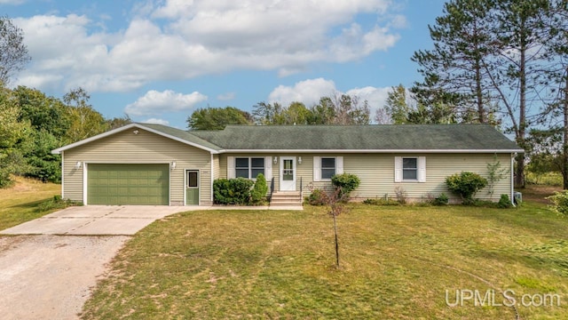 ranch-style house with a front yard and a garage