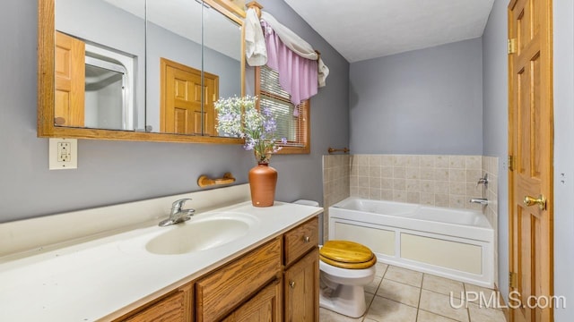 bathroom with a bath, tile patterned floors, toilet, and vanity