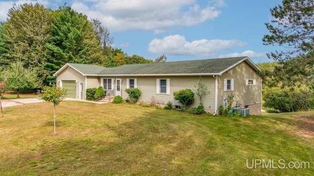 ranch-style home with a garage, a front lawn, and central air condition unit