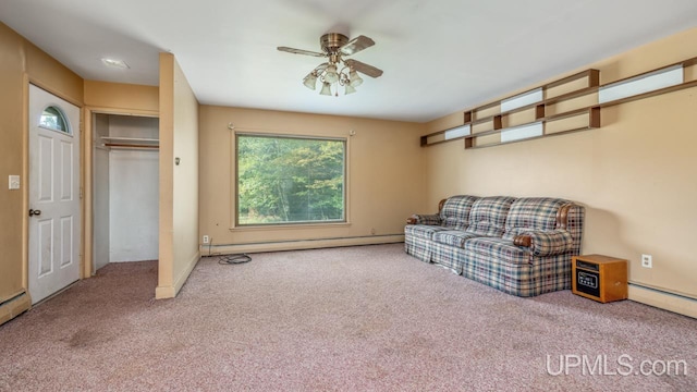 sitting room featuring ceiling fan, a baseboard radiator, and carpet