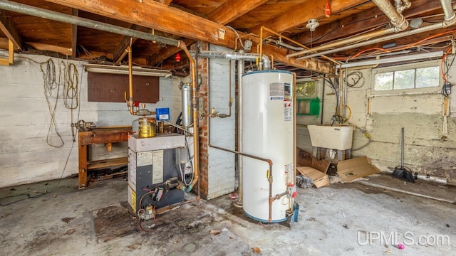 basement with water heater and sink