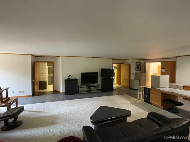 living room with dark carpet and crown molding