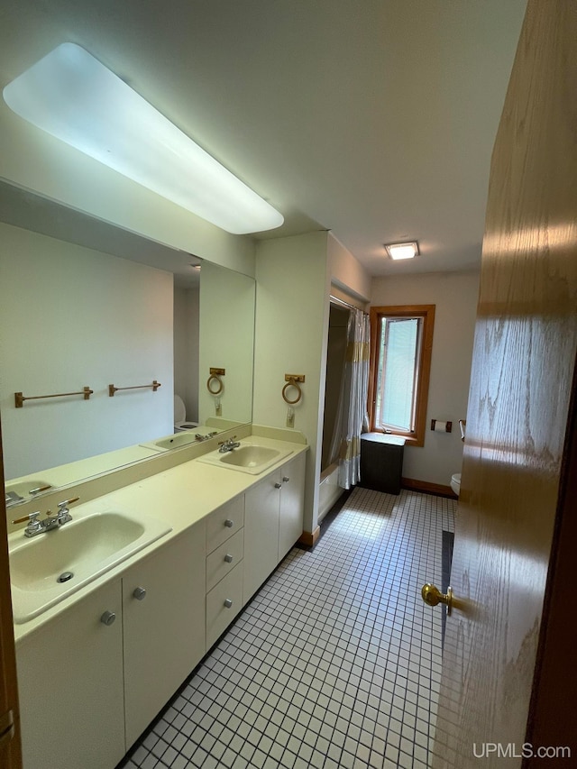 full bathroom featuring vanity, shower with separate bathtub, tile patterned flooring, and toilet