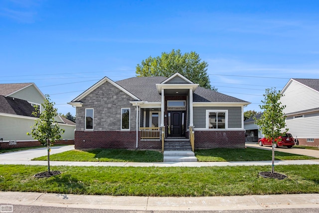 view of front of house with a garage and a front lawn