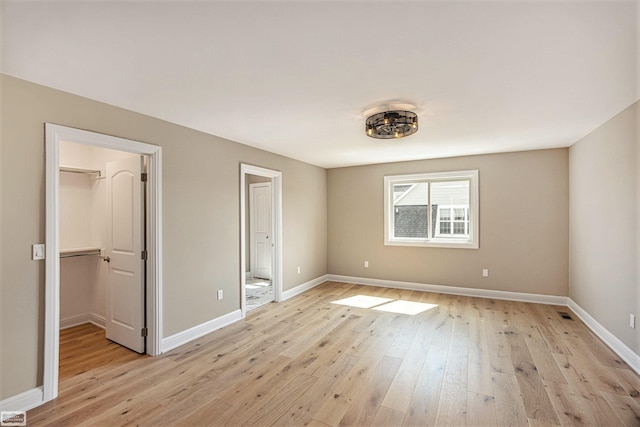 unfurnished room featuring light hardwood / wood-style floors