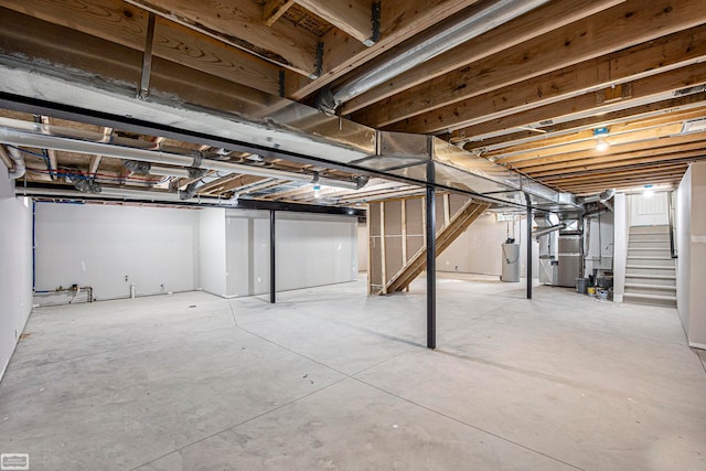 basement with heating unit and water heater