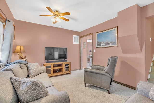 living room with ceiling fan and light colored carpet