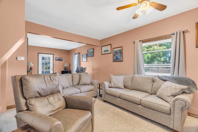 living room with ceiling fan and carpet floors