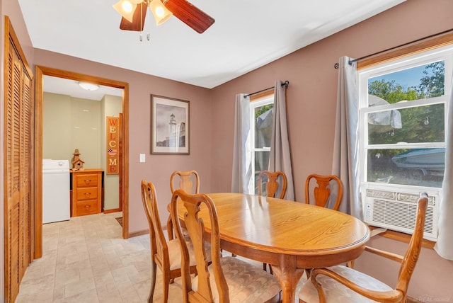 dining room with ceiling fan, cooling unit, washer / dryer, and a wealth of natural light