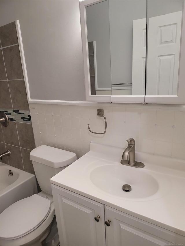 full bathroom featuring tile walls, independent shower and bath, backsplash, vanity, and toilet