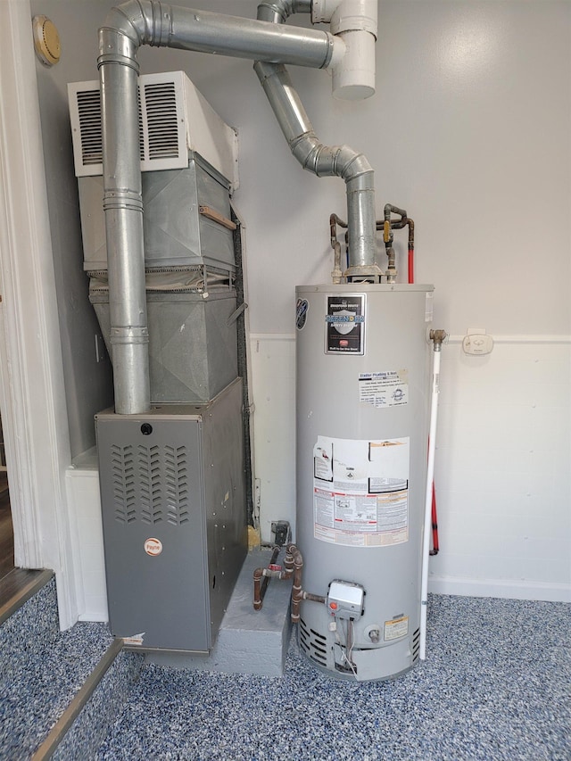 utility room with water heater and heating unit