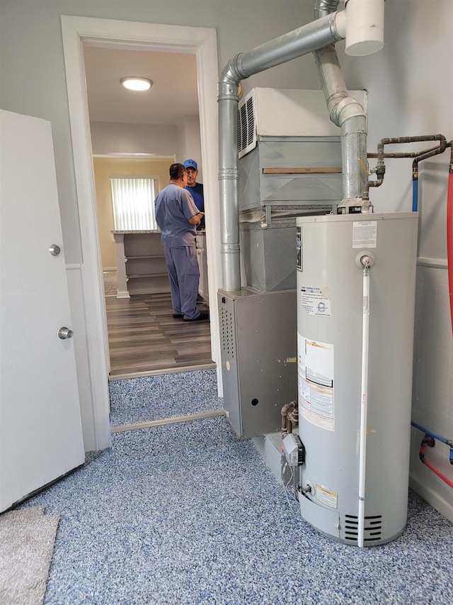 utility room featuring gas water heater