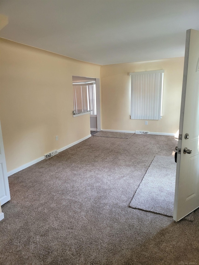 unfurnished room featuring carpet flooring