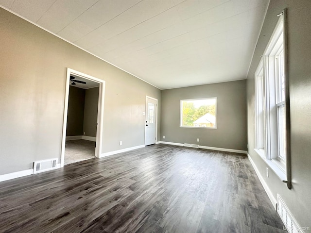 spare room featuring ceiling fan and dark hardwood / wood-style flooring