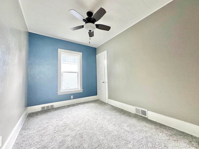 empty room with carpet and ceiling fan