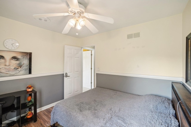 bedroom with ceiling fan and dark hardwood / wood-style flooring