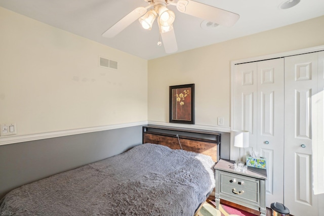 bedroom with ceiling fan and a closet