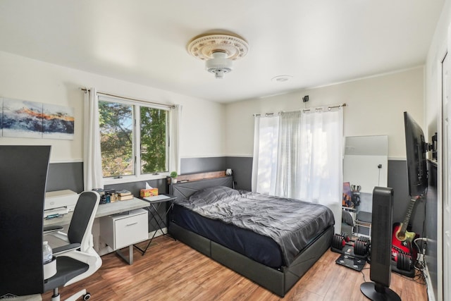 bedroom with light wood-type flooring