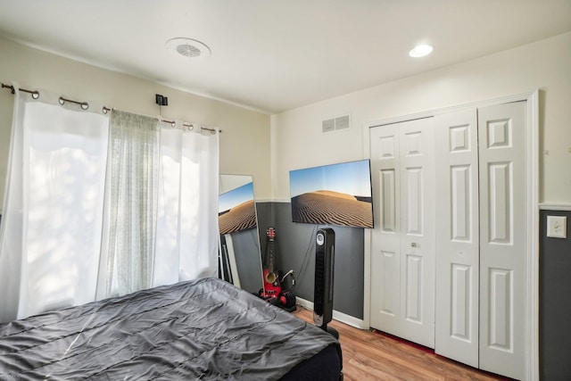 bedroom featuring a closet and hardwood / wood-style floors