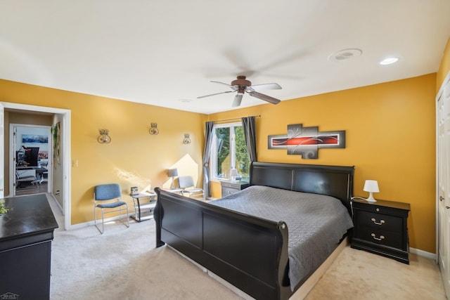 carpeted bedroom featuring ceiling fan