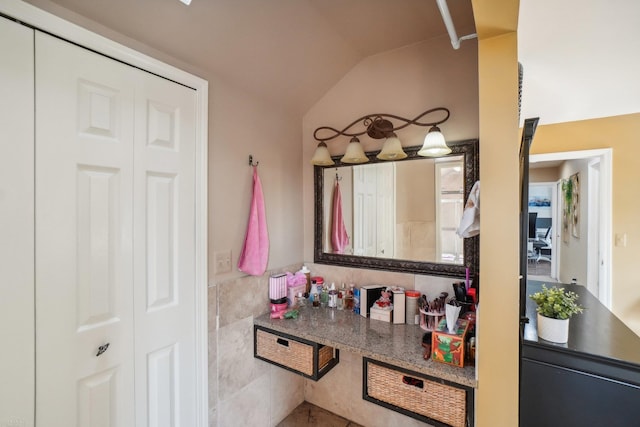 bathroom with lofted ceiling