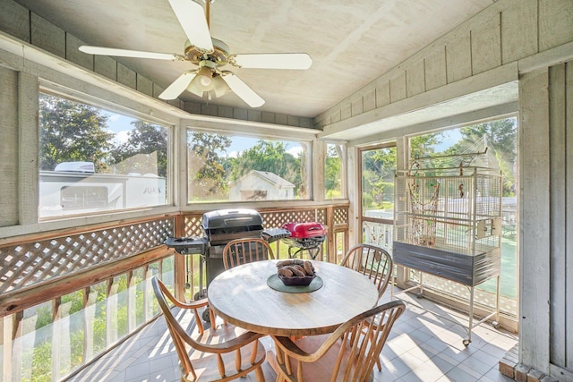 sunroom / solarium featuring ceiling fan and plenty of natural light