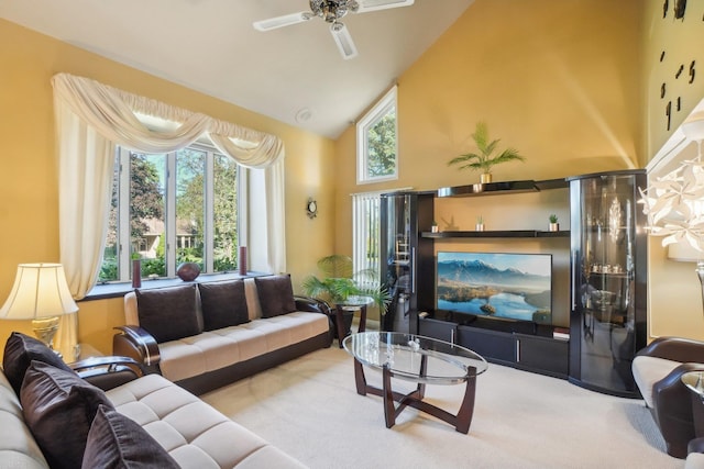 carpeted living room with high vaulted ceiling and ceiling fan