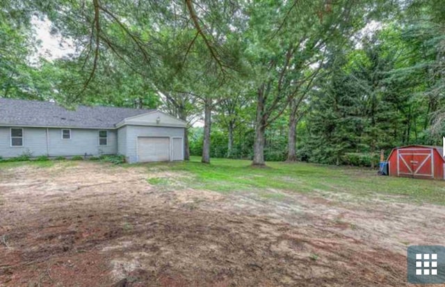 view of yard with a garage