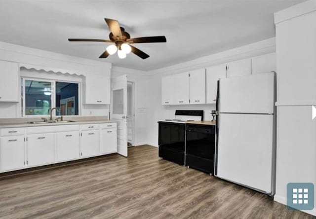 kitchen featuring ceiling fan, sink, white cabinetry, white fridge, and dark hardwood / wood-style flooring